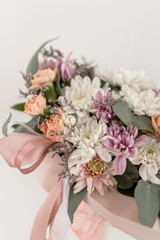 Flower arrangement in a glass with a straw on a white background. flower lemonade