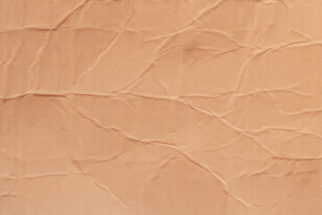 Old cardboard background with folds and creases.