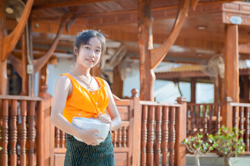 Girl in traditional Thai dress Songkran Festival in Thailand
