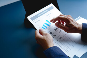 Businessman doing finances and calculate about cost to investment , business Financing Accounting Banking Concept, tax system