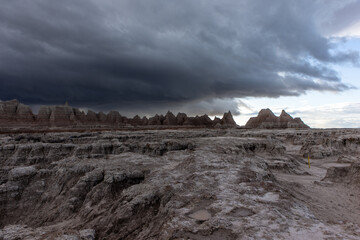 Fototapeta na wymiar A storm is brewing over the landscape at Badlands National Park in South Dakota