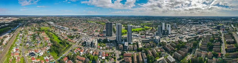  Panoramic aerial drone view of Liverpool in Greater Western Sydney, New South Wales, Australia looking west showing the high rise residential apartments © Steve
