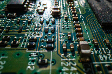 Circuit board. Technological electronic plate with roads and other components, selective focus. Technology background, electronics texture.