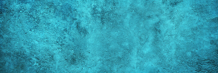 Fototapeta na wymiar Blue green abstract background. Toned rough rock surface texture. Beautiful teal background with copy space for design. Wide banner. Panoramic.