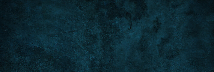 Black blue green abstract background. Toned rough concrete wall surface texture. Dark background with space for design. Grunge. Web banner. Wide. Panoramic.