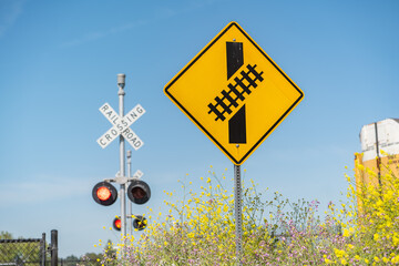 Skewed railroad crossing sign. Traffic sign "The railroad crossing"