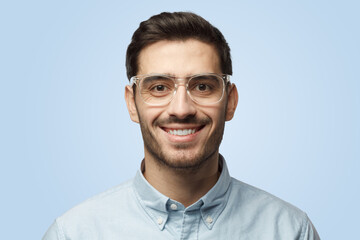 Smiling bearded business man in shirt and eyeglasses