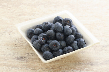 Sweet ripe blueberry heap in the bowl