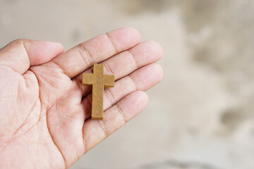 cross representing Jesus in human hand