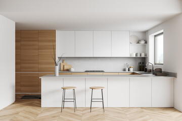 Light kitchen interior with island and seats, shelves and kitchenware, window