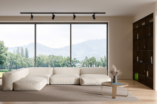 Light living room interior with couch and coffee table, shelf and panoramic window