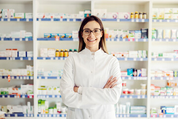 A successful young female pharmacist at pharmacy ready to help. - obrazy, fototapety, plakaty