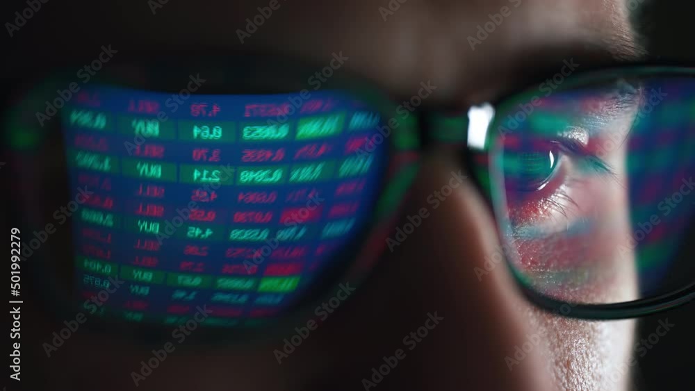 Poster trader is working with multiple computer screens with charts and data analysis and stock broker trad