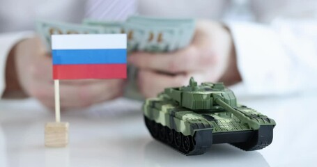 Russian flag and the tank in background counts dollars - Powered by Adobe