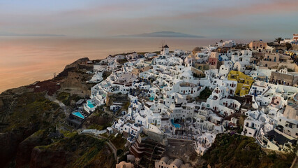Beautiful sunset skyline view in Oia town on Santorini island, Greece. Traditional white...