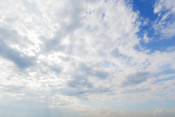 blue sky background with white clouds cumulus floating soft focus..