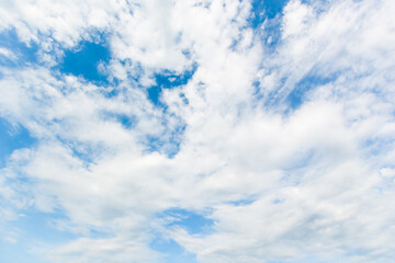 Naklejka na ściany i meble blue sky background with white clouds cumulus floating soft focus.