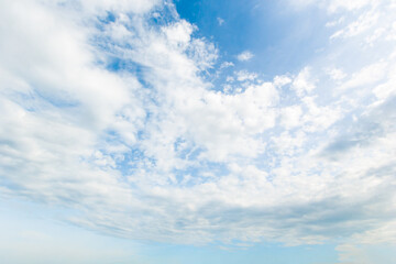 blue sky background with white clouds cumulus floating soft focus.