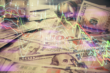 Multi exposure of forex chart drawing over us dollars bill background. Concept of financial success markets.