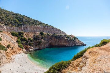 Bay on the Mediterranean coast of Turkey. Turquoise sea water. Sand beach. Lycian trail.
