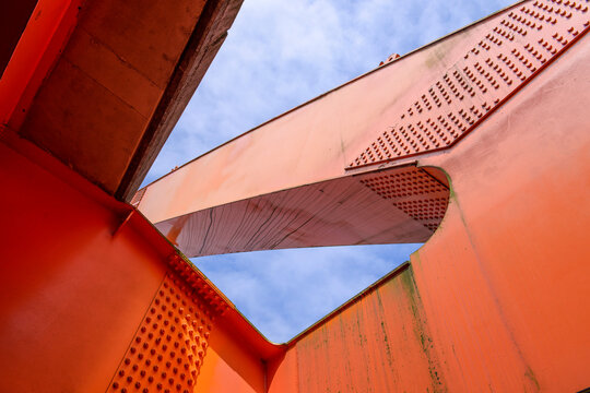Close up part of modern orange steel bridge © linjerry