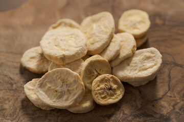 freeze dried banana chips on olive board