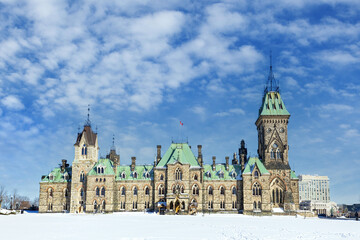 Ottawa parliament East Block, on a winter day with deep snow. The Canadian Houses of Parliament date back to 1867 and are modeled on the UK Parliamentary structure. - obrazy, fototapety, plakaty