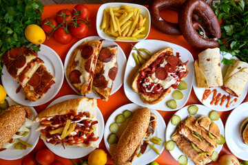 Delicious meat kebab with fresh vegetable salad served with variety of Turkish dishes and appetizers. Top view of assorted Turkish food and meze, tasty and healthy Mediterranean cuisine.