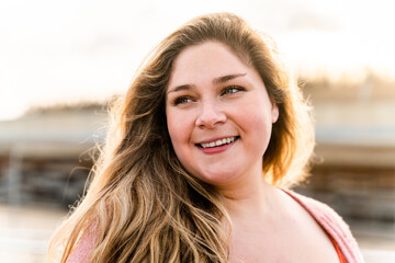 Beautiful plus size young woman outdoors, concepts about body acceptance, body positive and self esteem