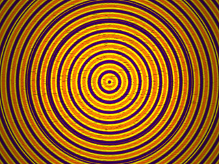 Yellow and purple circle pattern textured shiny pattern from center spread out
