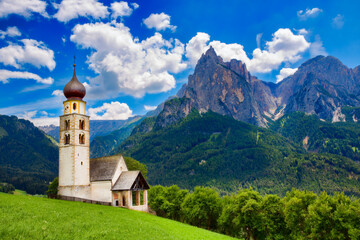 Fototapeta premium St Valentine's Church, Seis am Schlern, Italy, with the Impressive Mountain Schlern in the Background