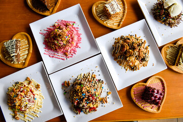 Table scene of assorted take out or delivery foods. Traditional Turkish cuisine. Various Turkish desert and cake. Top down view on a table.