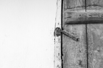 wooden door and there is a lock on it, the old classic house door with the lock