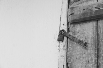 wooden door and there is a lock on it, the old classic house door and its lock are locked on it,