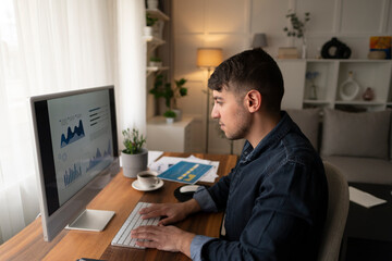 Young businessman in office working on laptop