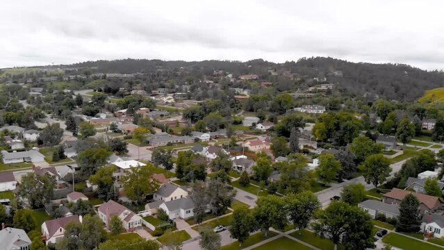 RAPID CITY, SD - JULY 2019: Panoramic aerial view of city skyline on a summer day. Slow motion