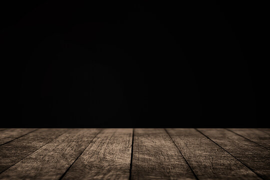 Empty Wooden Table in front of dark rustic wall for product display, dark wooden table , wooden product background