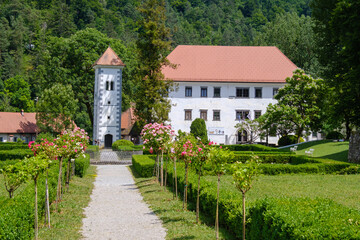 Fototapeta na wymiar POLHOV GRADEC mansion with blooming garden in summer
