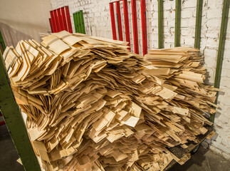 Woodworking industry. Natural veneer in bundles for further use in furniture manufacturing.