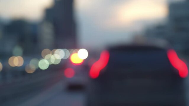 Blurred Police emergency lights flash at night. Blurred lights of a police car on a busy city street. Emergency response police patrol vehicle speeding to scene of crime at night.