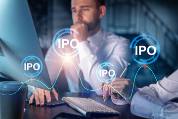 Two colleagues in formal wear working together to optimize IPO strategy. Financial chart hologram over modern office background