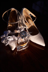 Morning of the bride. Wedding shoes ring perfumes