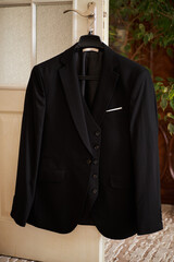 Wedding fashionable men's black suit and tie