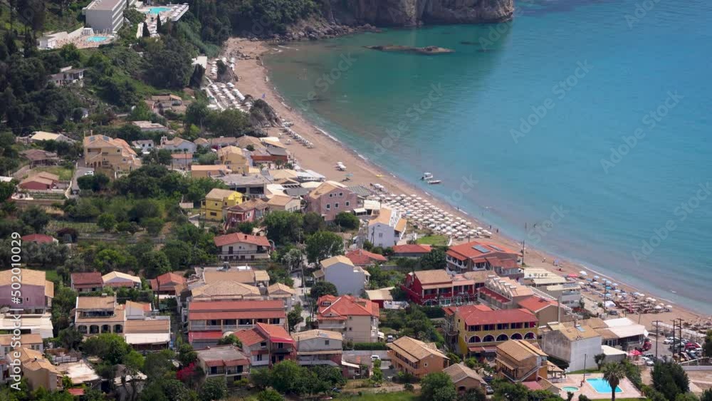 Wall mural Houses and beach in Agios Gordios town on a Greek Island of Corfu, 4k video