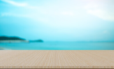 Fototapeta premium blurred natural blue sea gradient glow backdrop with retro brown wood texture panel color background for advertise,show,promote products on display
