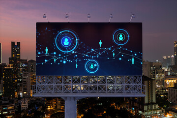 Glowing Social media icons on billboard over night panoramic city view of Bangkok. The concept of networking and establishing new connections between people and businesses in Southeast Asia