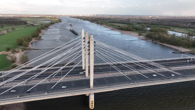 Road surface and traffic on Tacitusbrug bij Ewijk modern suspension bridge crossing the river Waal near Nijmegen, the Netherlands Holland Europe. Valburg and Ewijk.