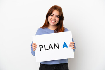 Young redhead woman isolated on white background holding a placard with the message PLAN A