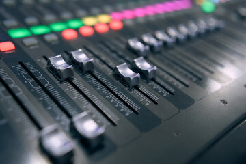 Professional audio mixing console. ​Mixer. Pro audio mixing board faders and knobs. Static shot...
