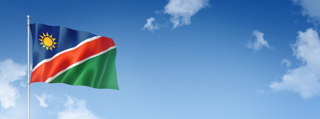 Namibian flag isolated on a blue sky. Horizontal banner